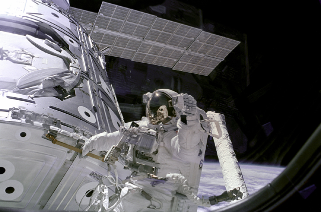 Space History Photo: Newman Waves at Camera from Unity Module